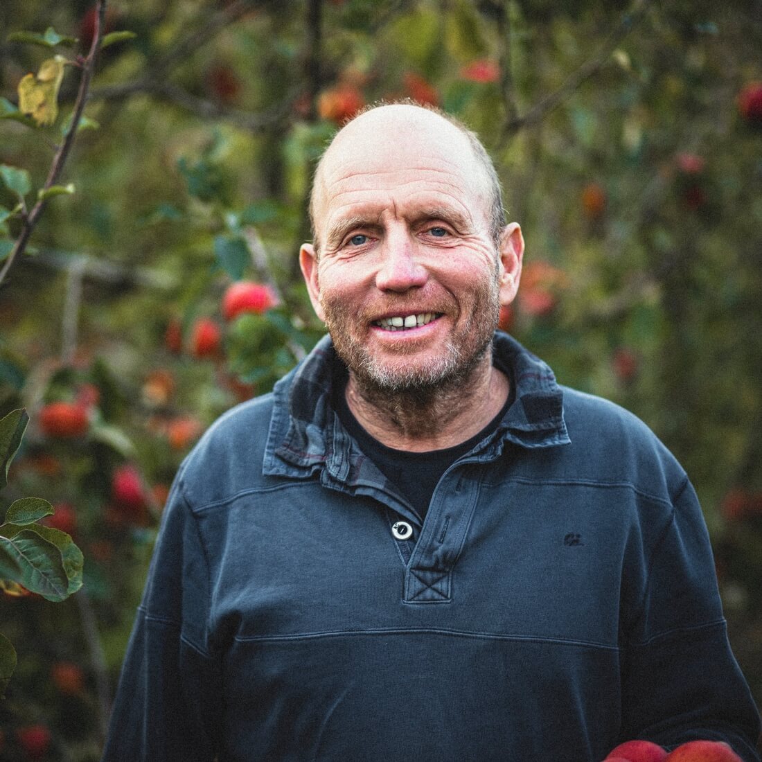 Portrait photograph of Paul Ward, who grows apples for Riverford on his orchard in Kent.